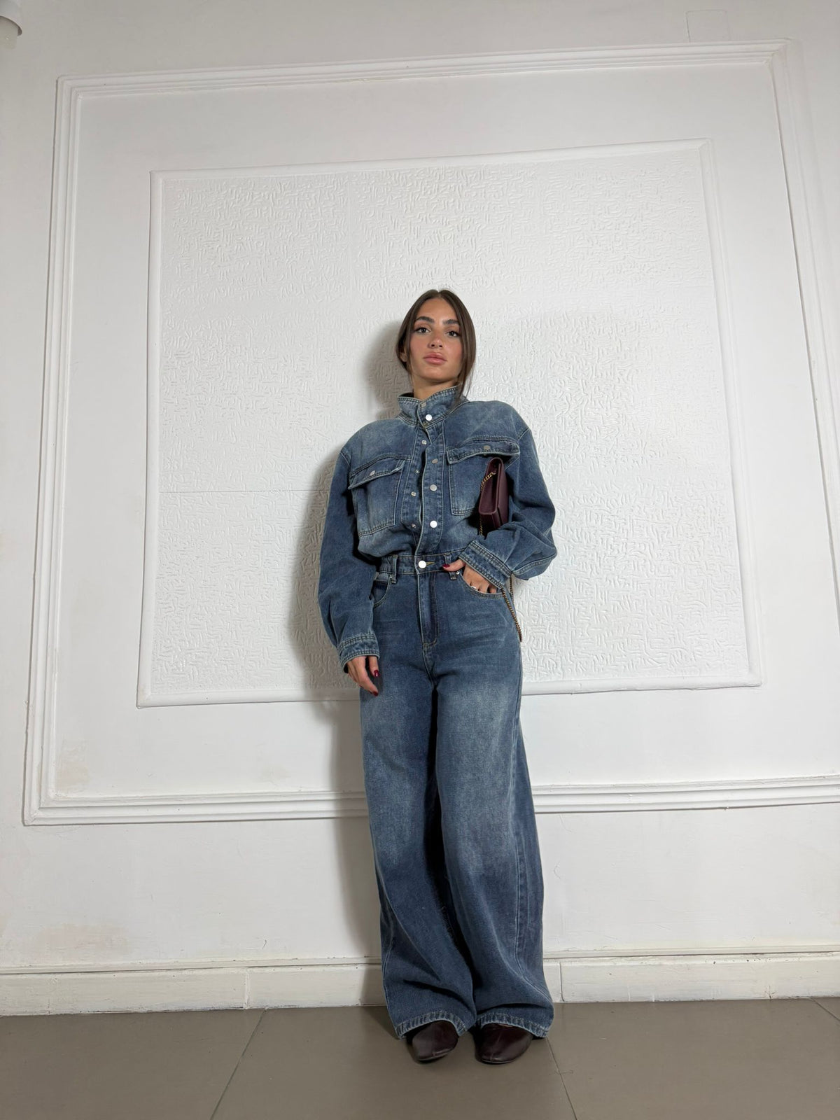 Tutone in Jeans con bottoni e pistagnina