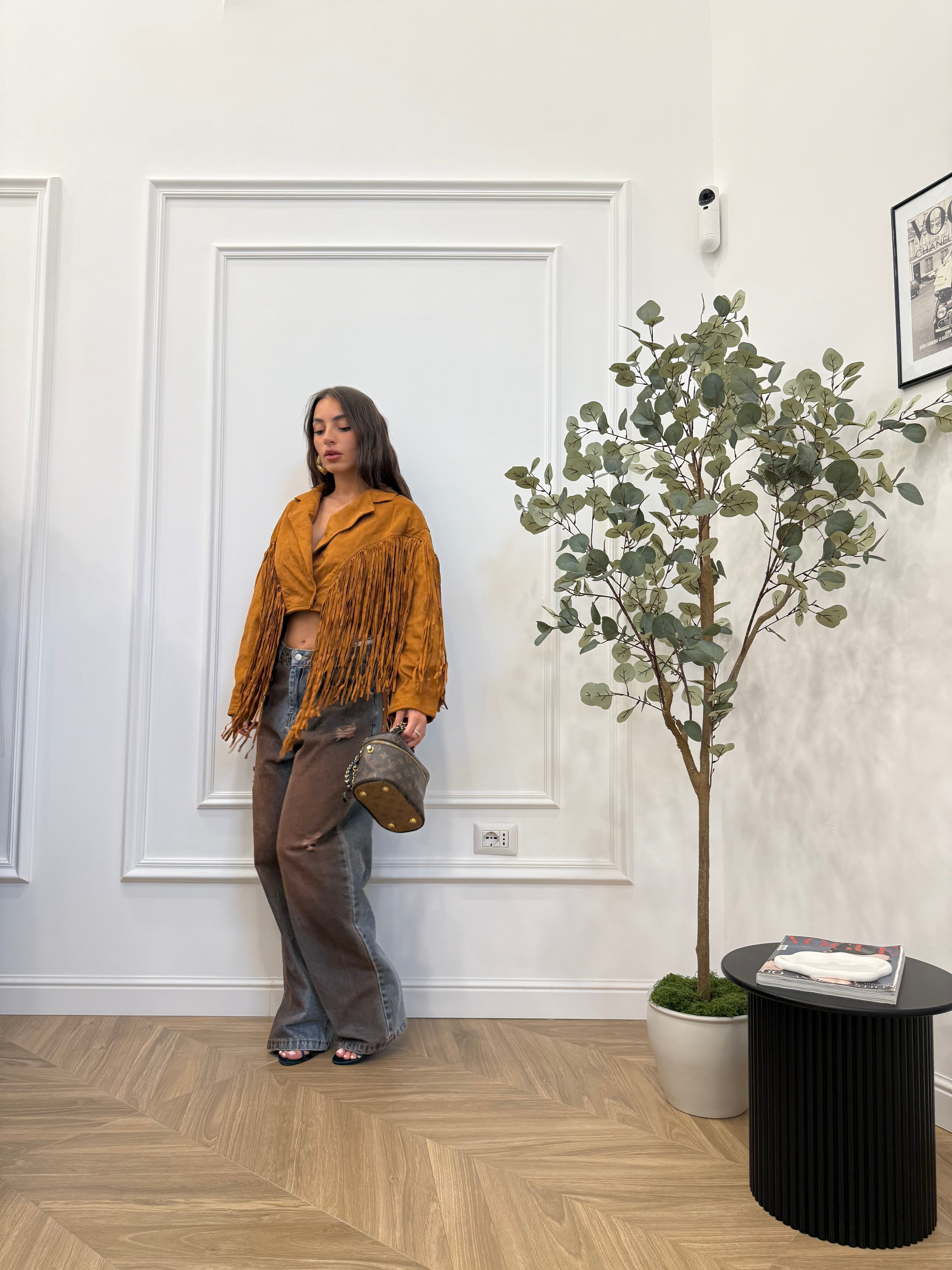 Jeans slavato con tasche